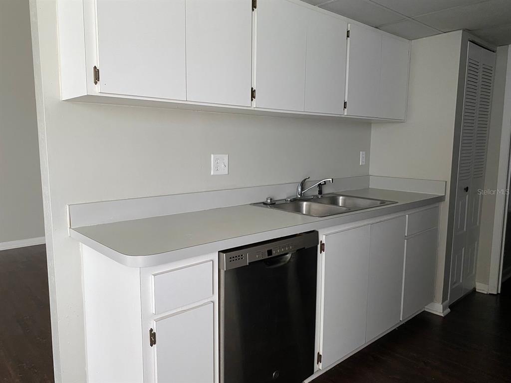 2858 Southwest 39th Avenue Gainesville, FL 32608 - Photo 4 of 12 a kitchen with a sink and cabinets