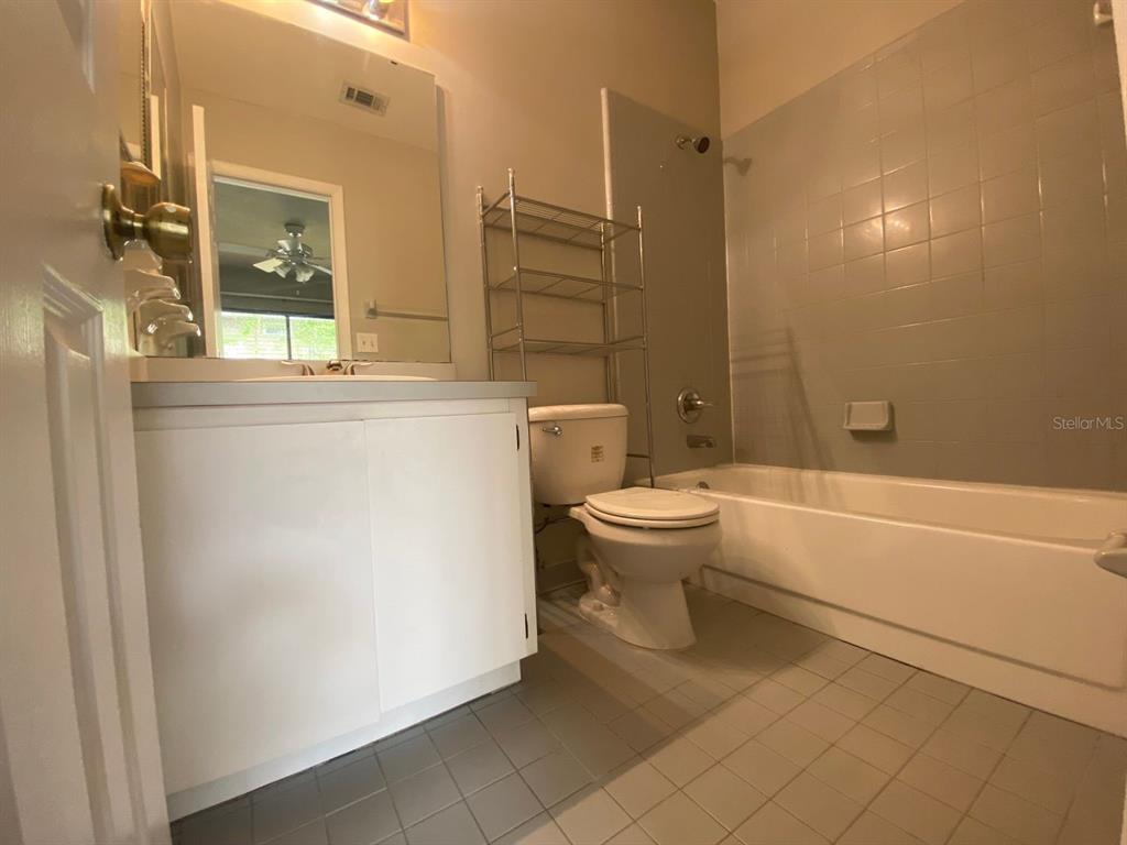 2858 Southwest 39th Avenue Gainesville, FL 32608 - Photo 8 of 12 a bathroom with a toilet a sink and bathtub