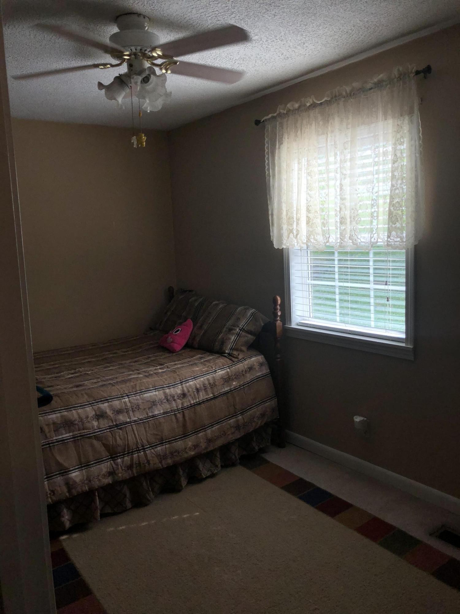 159 Foust Hollow Road Heiskell, TN 37754 - Photo 15 of 16 a bedroom with a bed and window