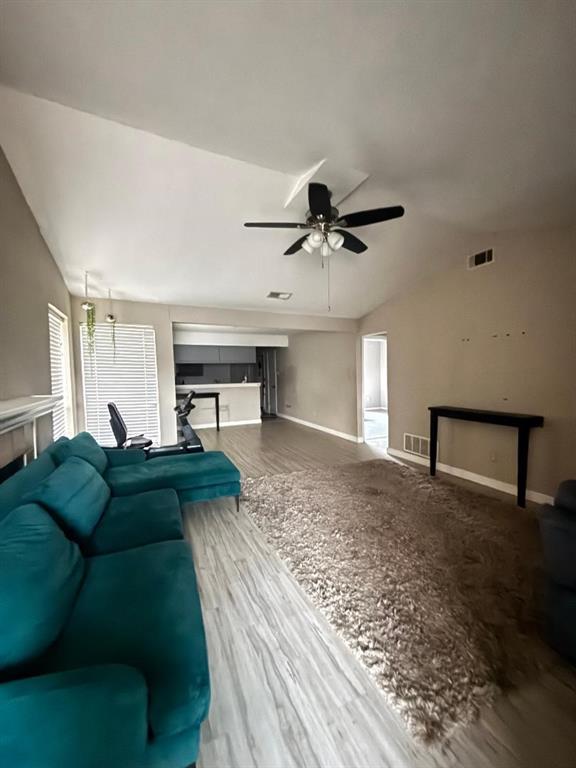 1107 Rimcrest Drive Arlington, TX 76017 - Photo 4 of 13 a living room with furniture and a rug
