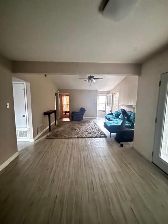 1107 Rimcrest Drive Arlington, TX 76017 - Photo 5 of 13 a living room with furniture and a wooden floor