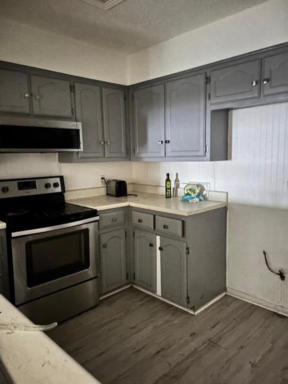 1107 Rimcrest Drive Arlington, TX 76017 - Photo 8 of 13 a kitchen with cabinets appliances and a sink
