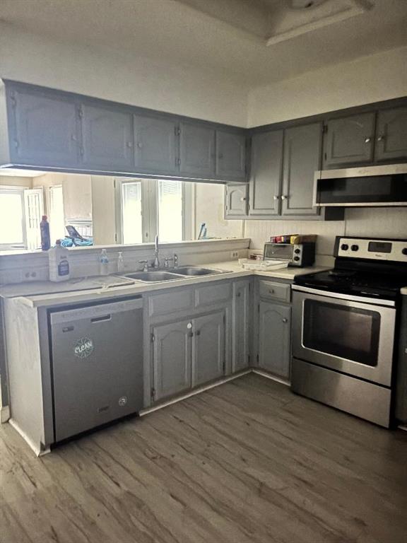 1107 Rimcrest Drive Arlington, TX 76017 - Photo 9 of 13 a kitchen with stainless steel appliances granite countertop a stove a sink and a microwave