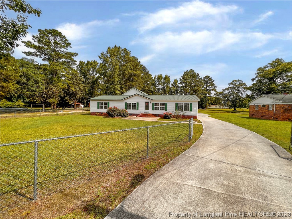 74 Decker Road St. Pauls, NC 28384 - Photo 1 of 46 a view of house with outdoor space