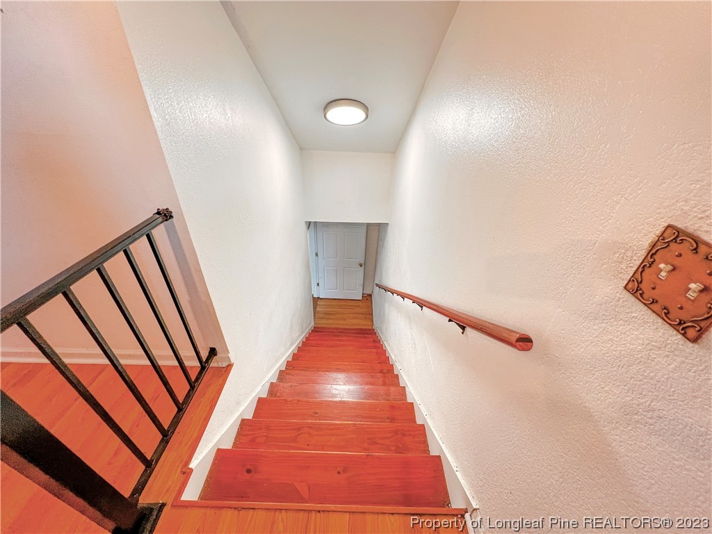 74 Decker Road St. Pauls, NC 28384 - Photo 14 of 46 a view of a hallway with wooden floor and staircase