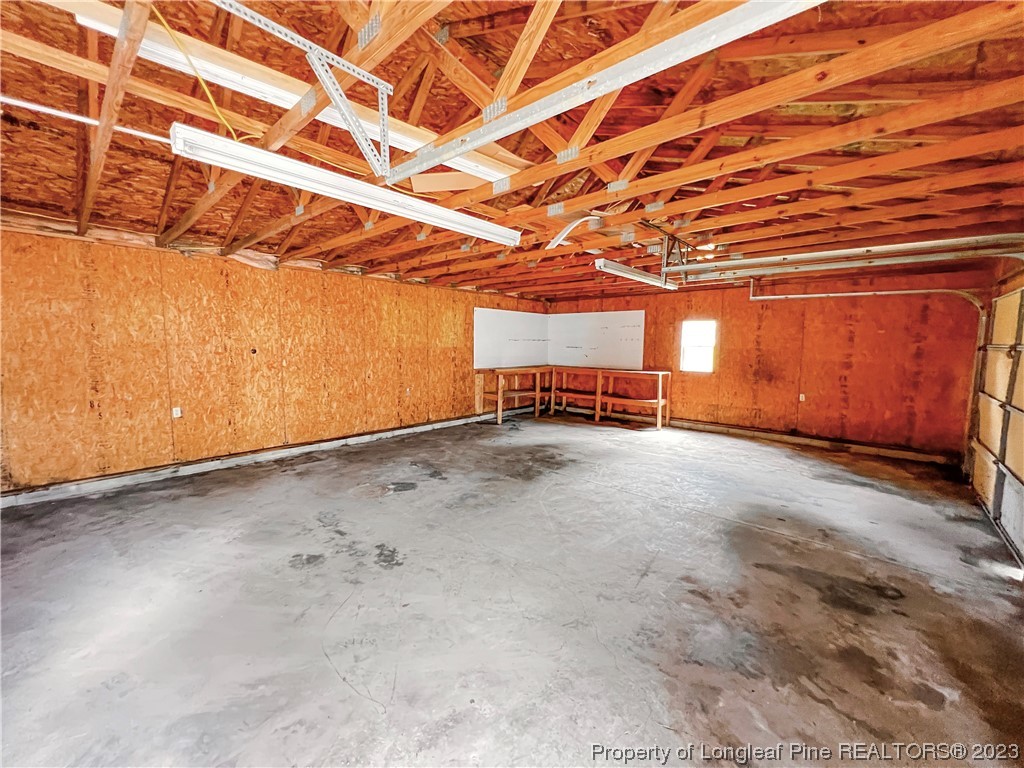 74 Decker Road St. Pauls, NC 28384 - Photo 19 of 46 an empty room with wooden floor and windows