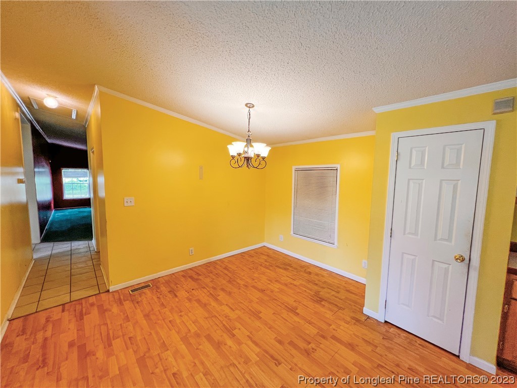 74 Decker Road St. Pauls, NC 28384 - Photo 30 of 46 a view of empty room with wooden floor