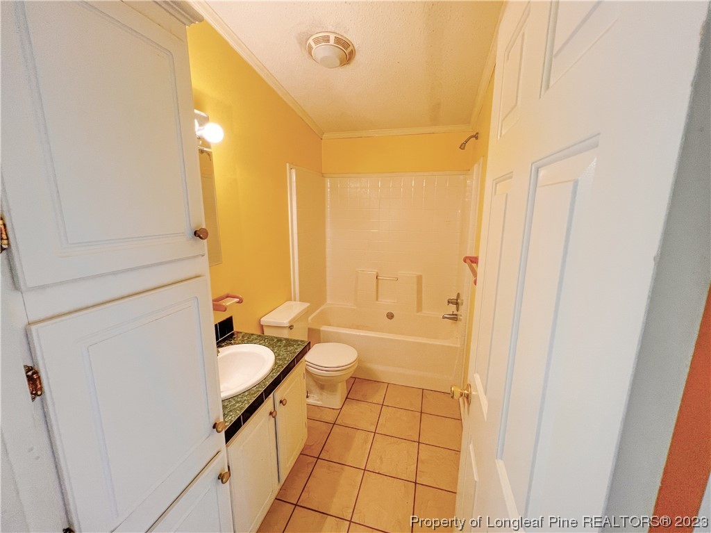 74 Decker Road St. Pauls, NC 28384 - Photo 43 of 46 a bathroom with a sink a mirror and a shower