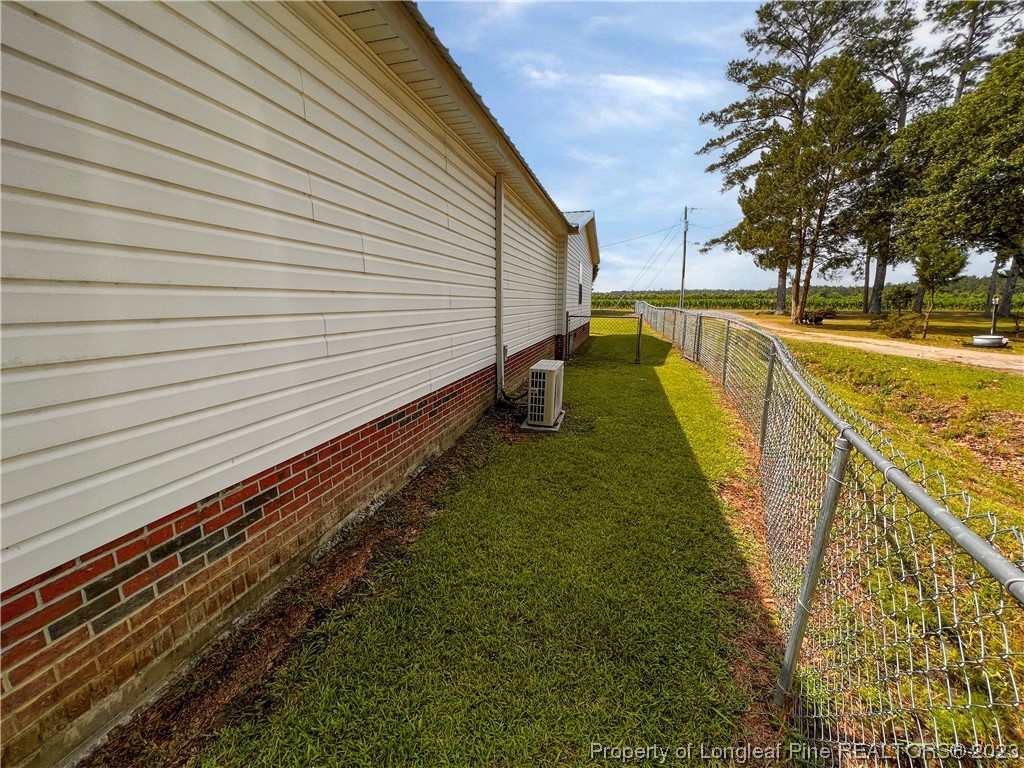 74 Decker Road St. Pauls, NC 28384 - Photo 10 of 46 a view of a yard with swimming pool