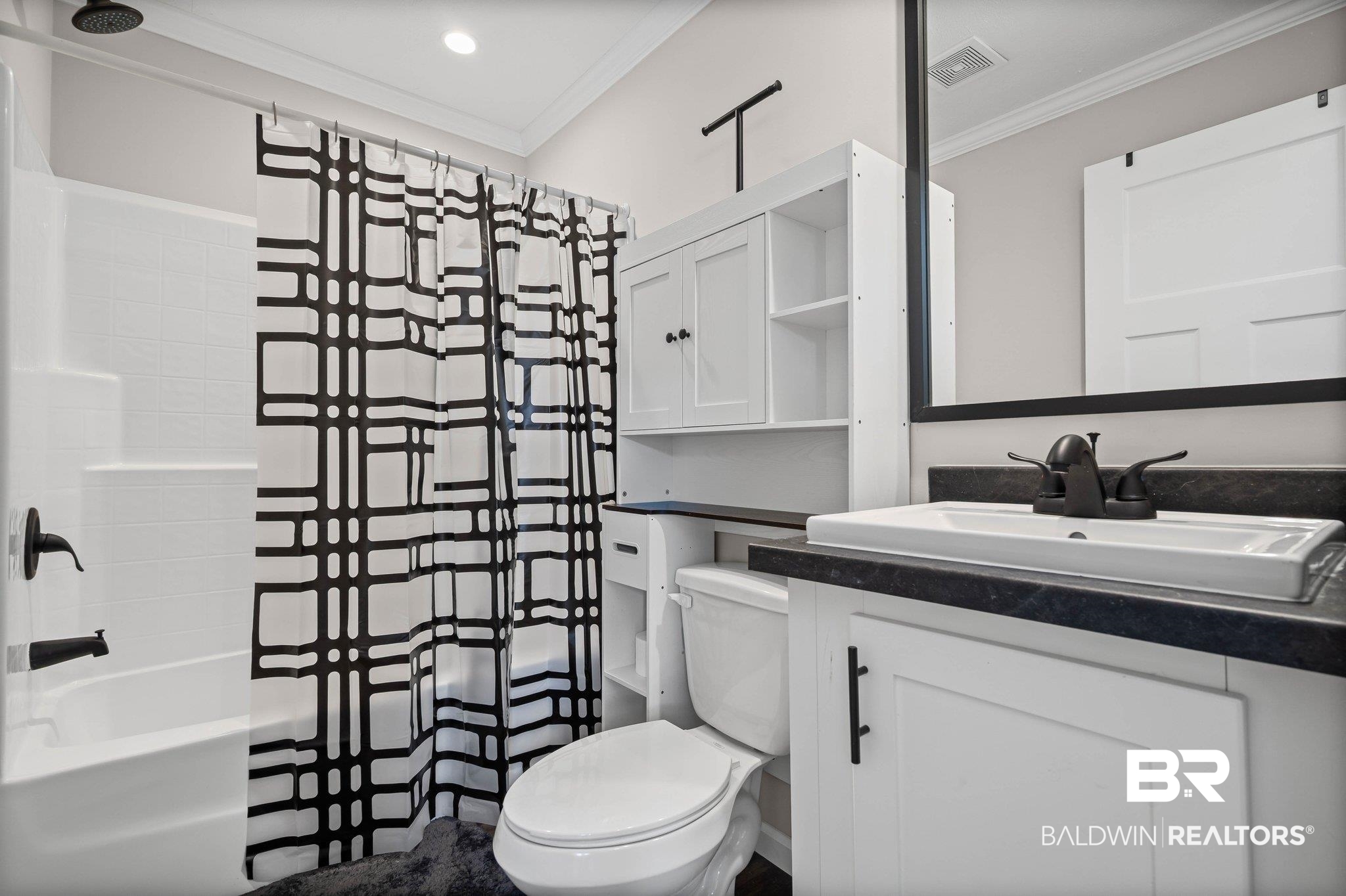 1325 Ridgewood Drive Lillian, AL 36549 - Photo 13 of 32 Bathroom with shower / tub combo with curtain, ornamental molding, and vanity