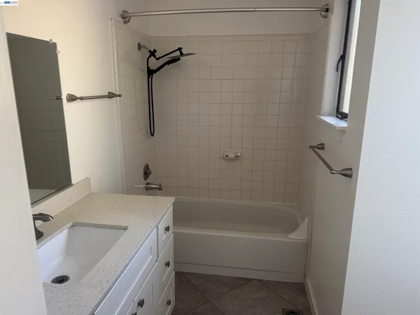 a bathroom with a sink a bath tub and a shower