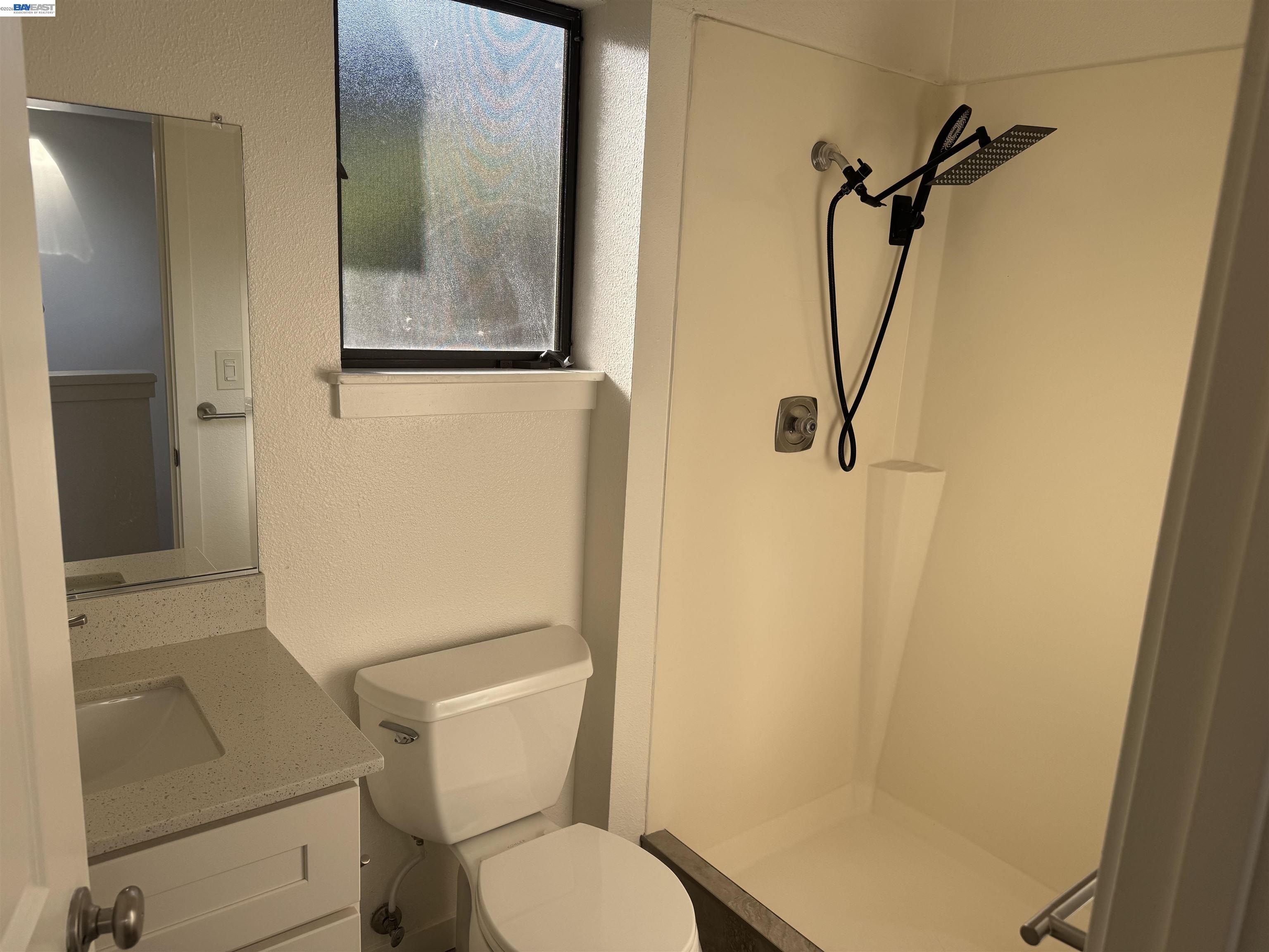 1836 Fifth Avenue San Rafael, CA 94901 - Photo 7 of 15 a white toilet sitting next to a bathroom sink