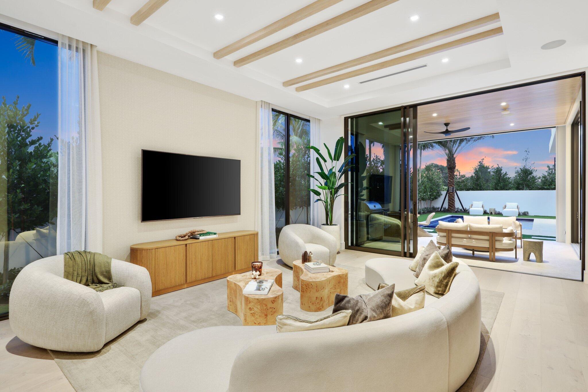 310 Grove Place Delray Beach, FL 33444 - Photo 30 of 92 a living room with furniture and a flat screen tv