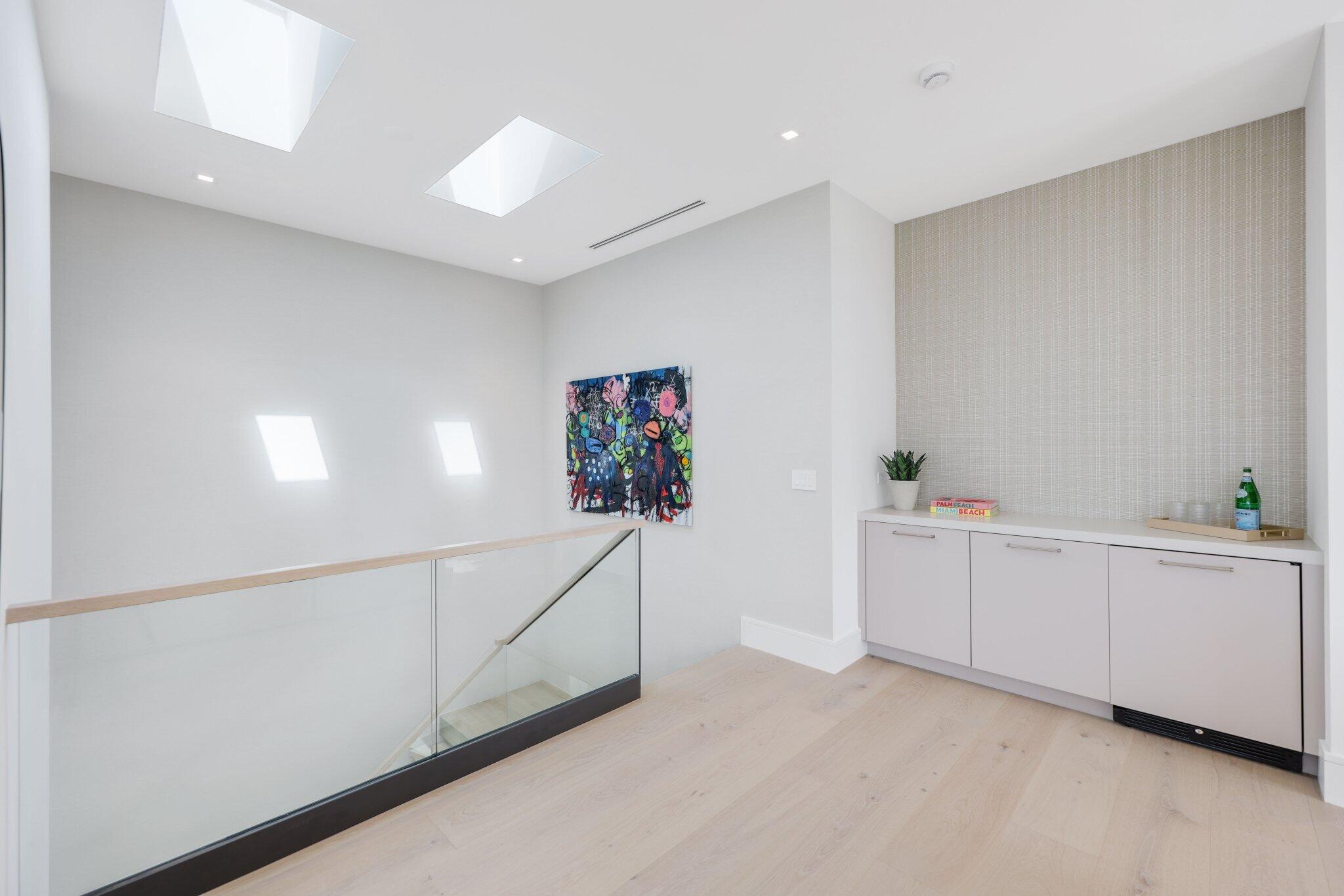 310 Grove Place Delray Beach, FL 33444 - Photo 36 of 92 a room with white cabinets and white appliances