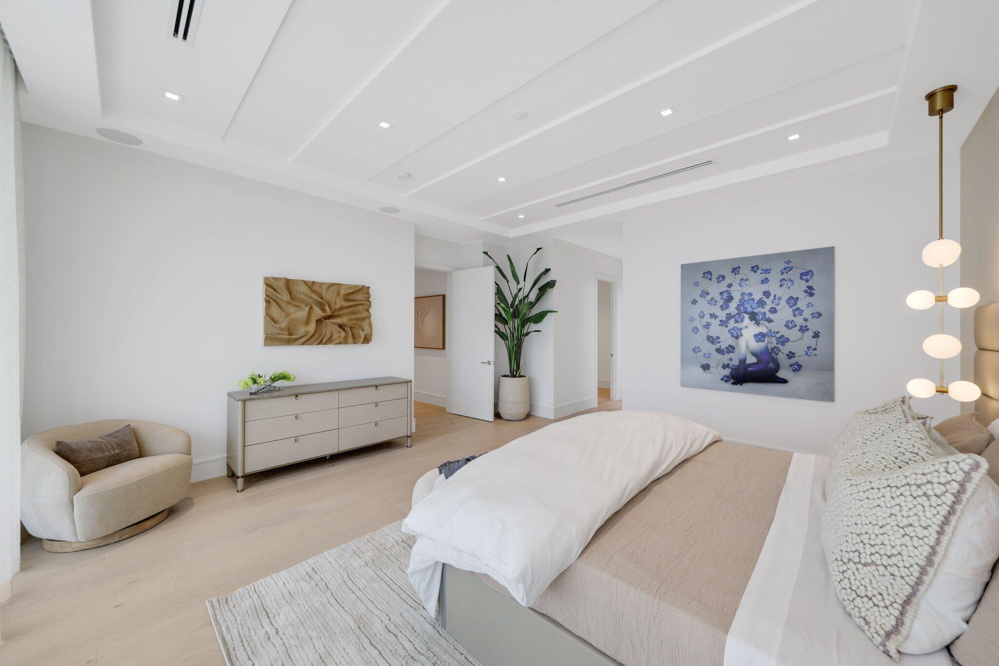 310 Grove Place Delray Beach, FL 33444 - Photo 47 of 92 a spacious bedroom with a bed and a couch