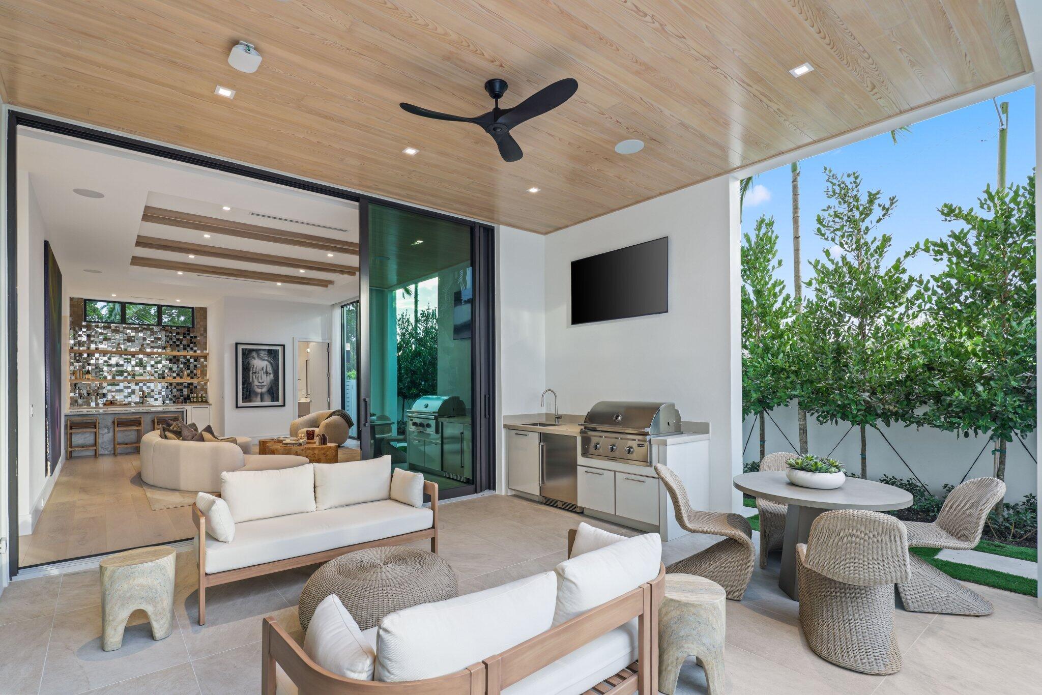 310 Grove Place Delray Beach, FL 33444 - Photo 68 of 92 a living room with furniture and a large window
