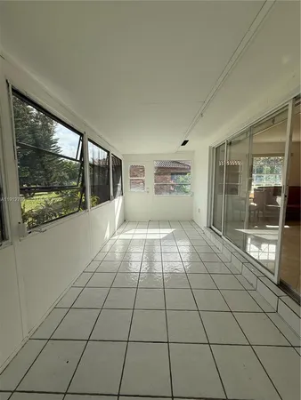 a view of an empty room and window