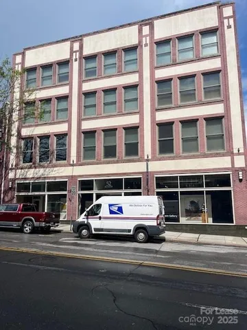 a cars parked in front of a building