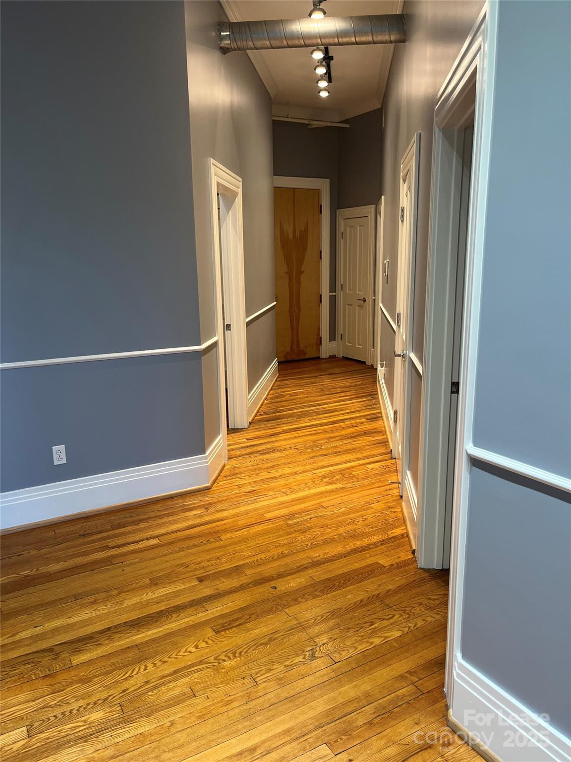 52 Biltmore Avenue, Unit 203 Asheville, NC 28801 - Photo 4 of 17 a view of a room with wooden floor