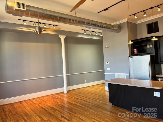 52 Biltmore Avenue, Unit 203 Asheville, NC 28801 - Photo 7 of 17 a view of a living room with wooden floor