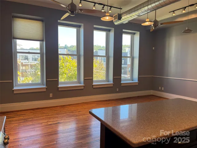 a view of a livingroom with furniture and window