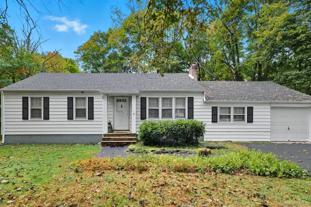 a house view with a garden space