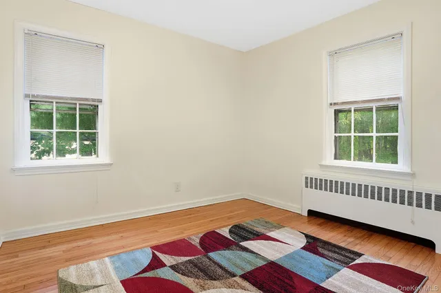 a room with a bed and a window