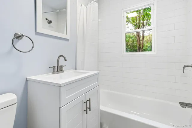 a bathroom with a toilet sink and a bathtub