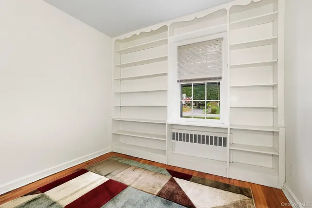 a view of bedroom with a bed and a window