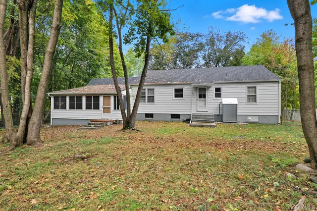 a house with trees in the background