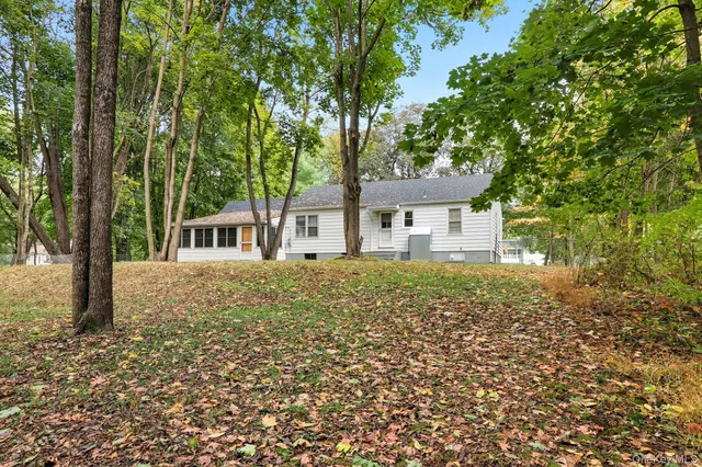 a house with trees in front of it