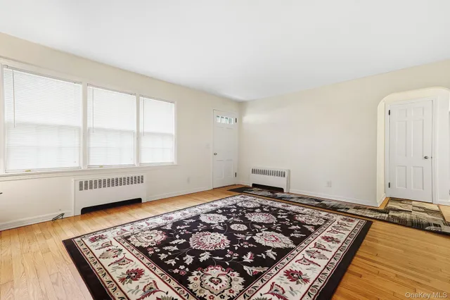 a bedroom with bed and a window