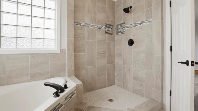 a bathroom with a shower and a bathtub