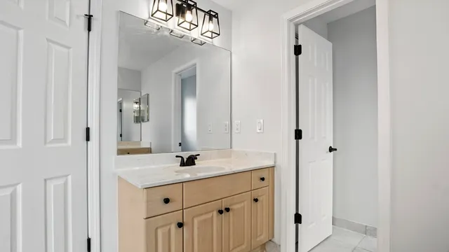 a bathroom with a sink and a mirror