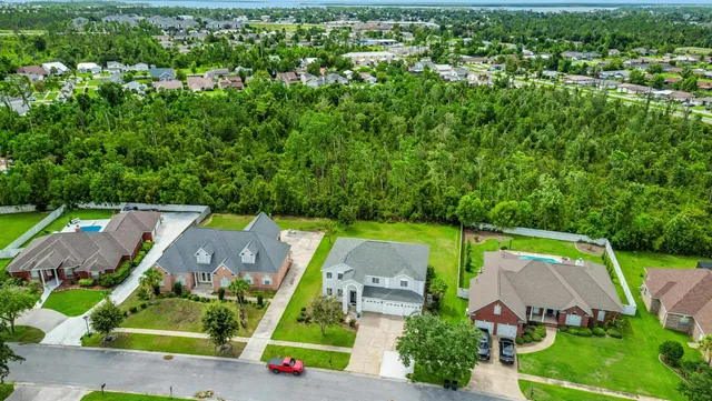 an aerial view of a house with a garden
