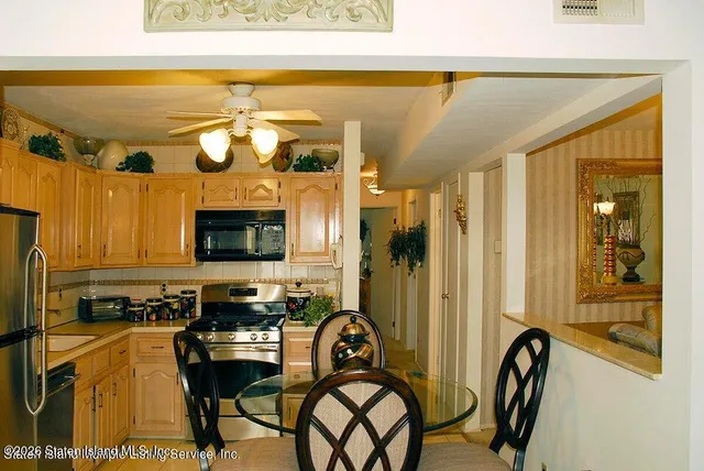 a view of a entryway door and dining area with furniture
