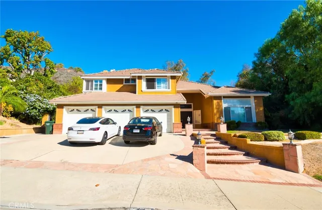 a view of a car park in front of house