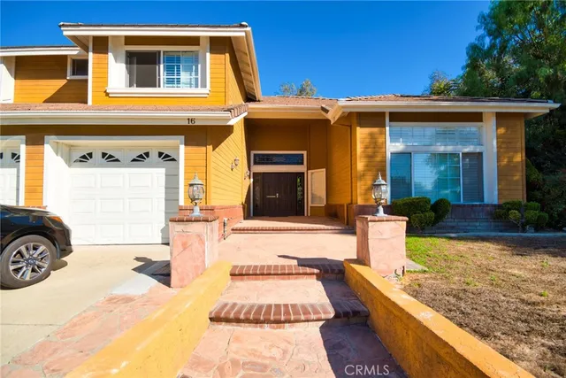 a front view of a house with swimming pool