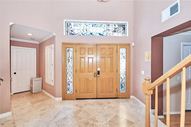 a view of an entryway with a hallway