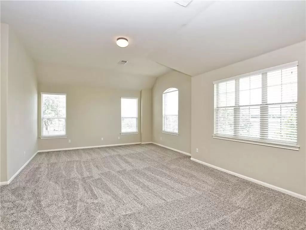 7005 Via Correto Drive Austin, TX 78749 - Photo 12 of 27 a view of an empty room with a window
