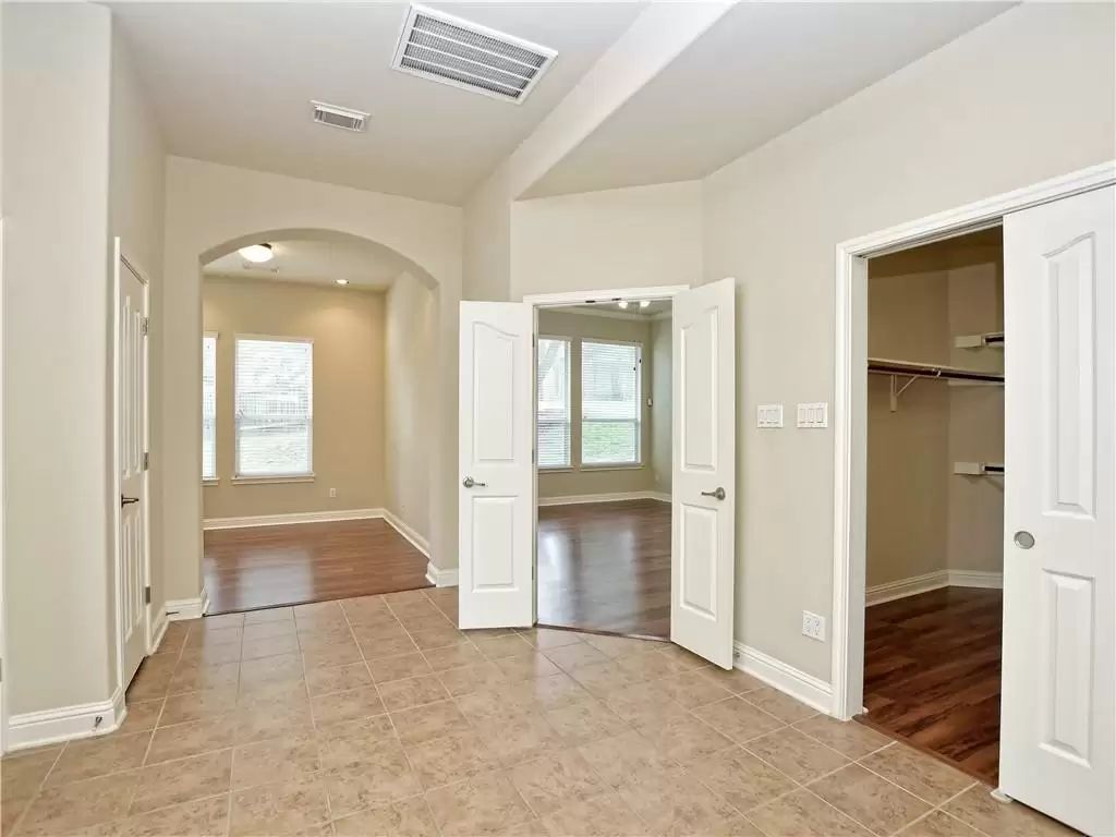 7005 Via Correto Drive Austin, TX 78749 - Photo 15 of 27 wooden floor and windows in a room