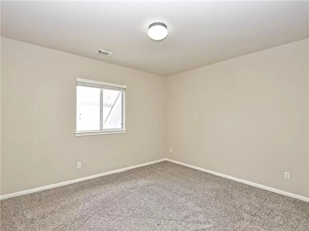 7005 Via Correto Drive Austin, TX 78749 - Photo 21 of 27 an empty room with a fan