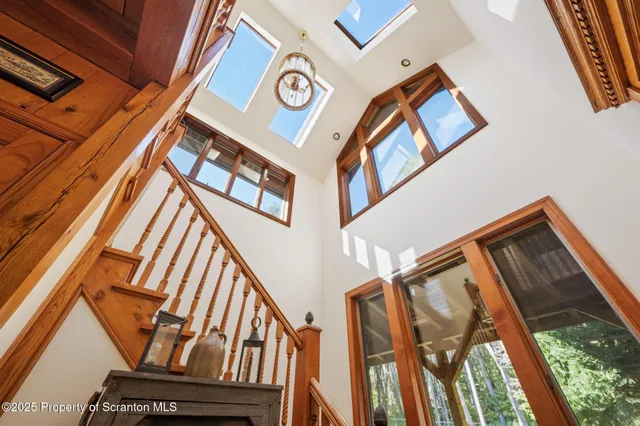 a kitchen with refrigerator and window