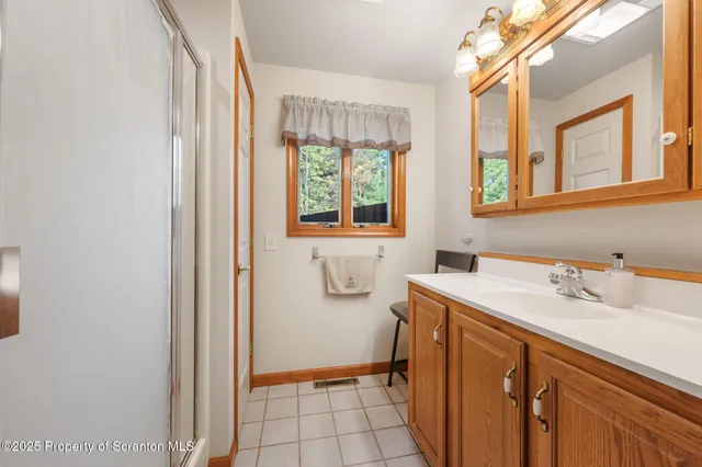 a kitchen with stainless steel appliances granite countertop a refrigerator a sink and a stove