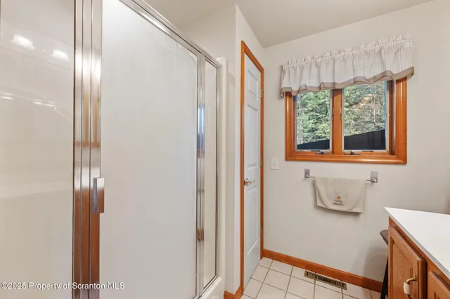 a bed sitting in a room next to a window