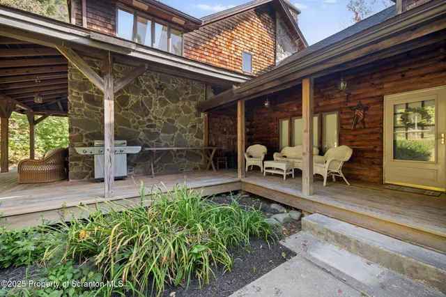 a view of a house with a yard and sitting area