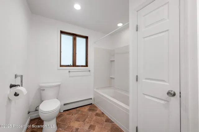 a view of a park that has large trees