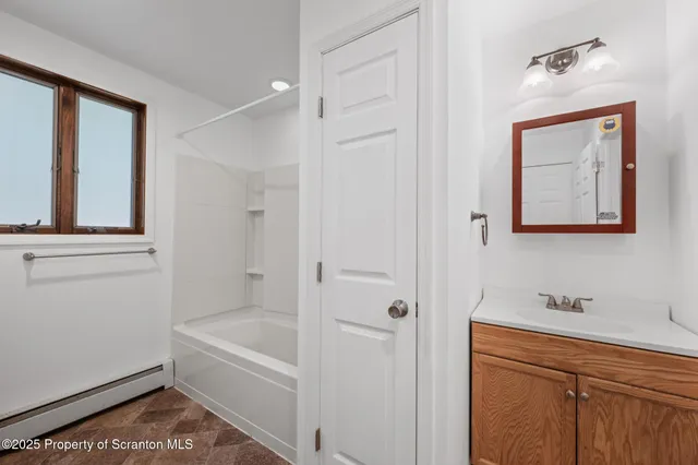 a picture of a bench in front of a window