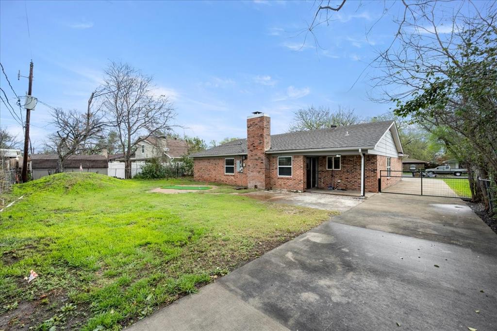 1405 Timberline Drive Benbrook, TX 76126 - Photo 24 of 26 a front view of a house with a yard and garage
