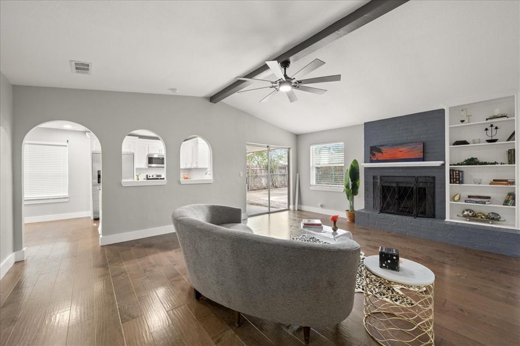 1405 Timberline Drive Benbrook, TX 76126 - Photo 4 of 26 a living room with furniture and a fireplace